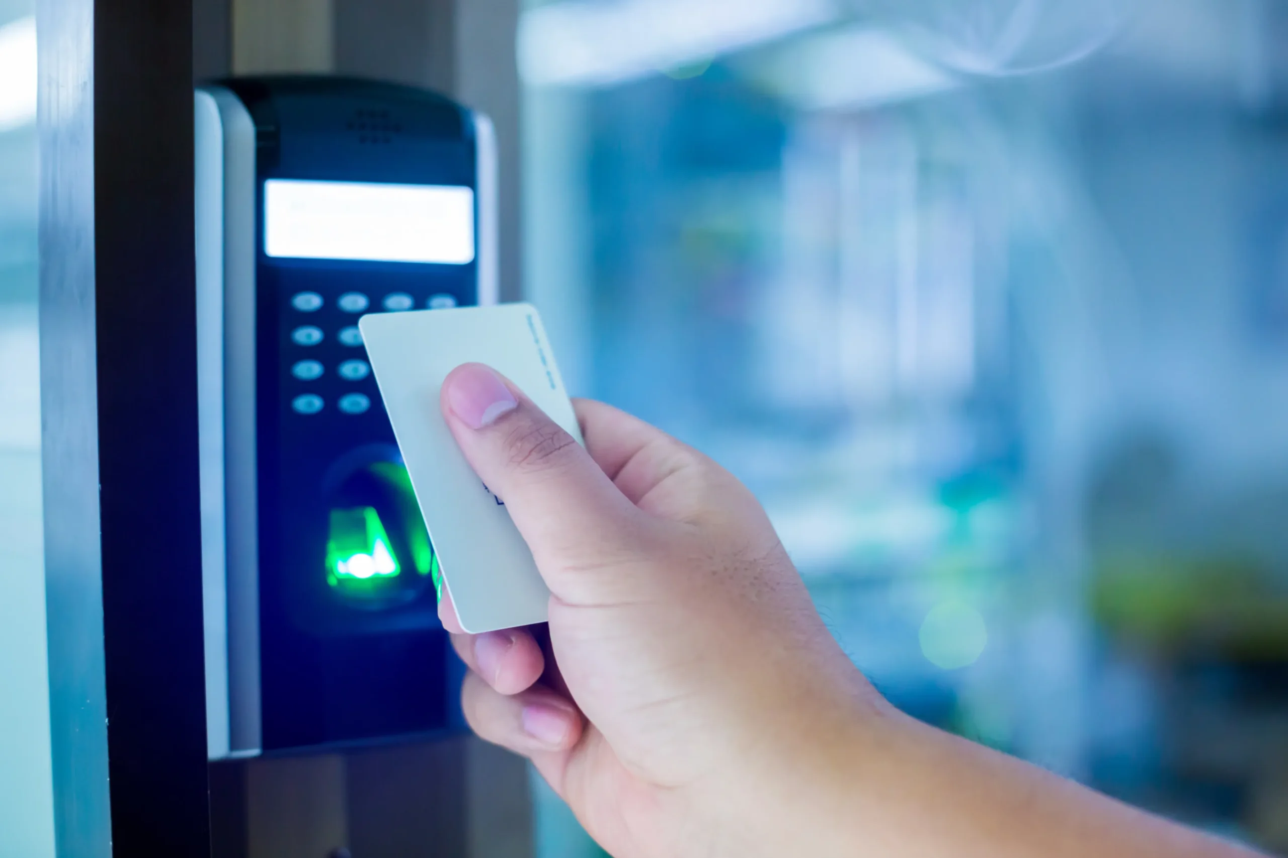 Access control system Security showing staff using an electronic key card and fingerprint scan to lock and unlock a door in a home or condominium.