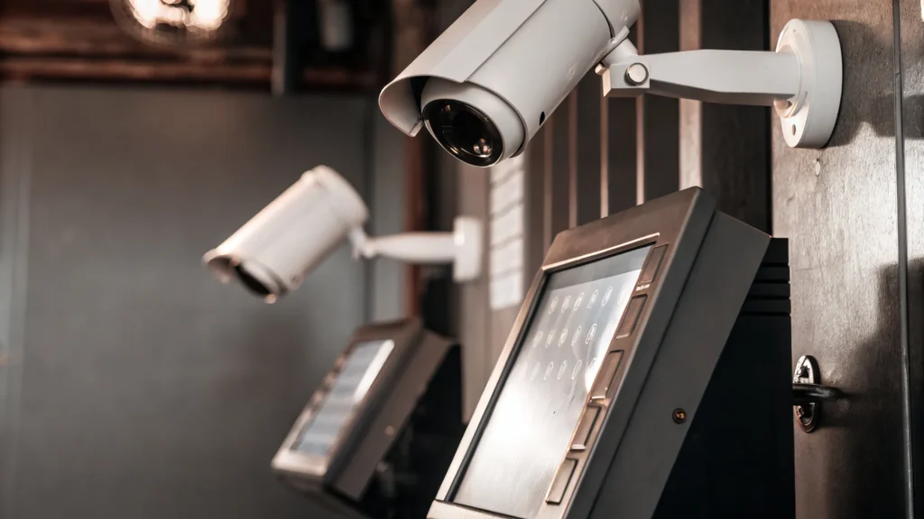 High-tech CCTV and access control system with biometric authentication and integrated security cameras monitoring a secure facility entrance.