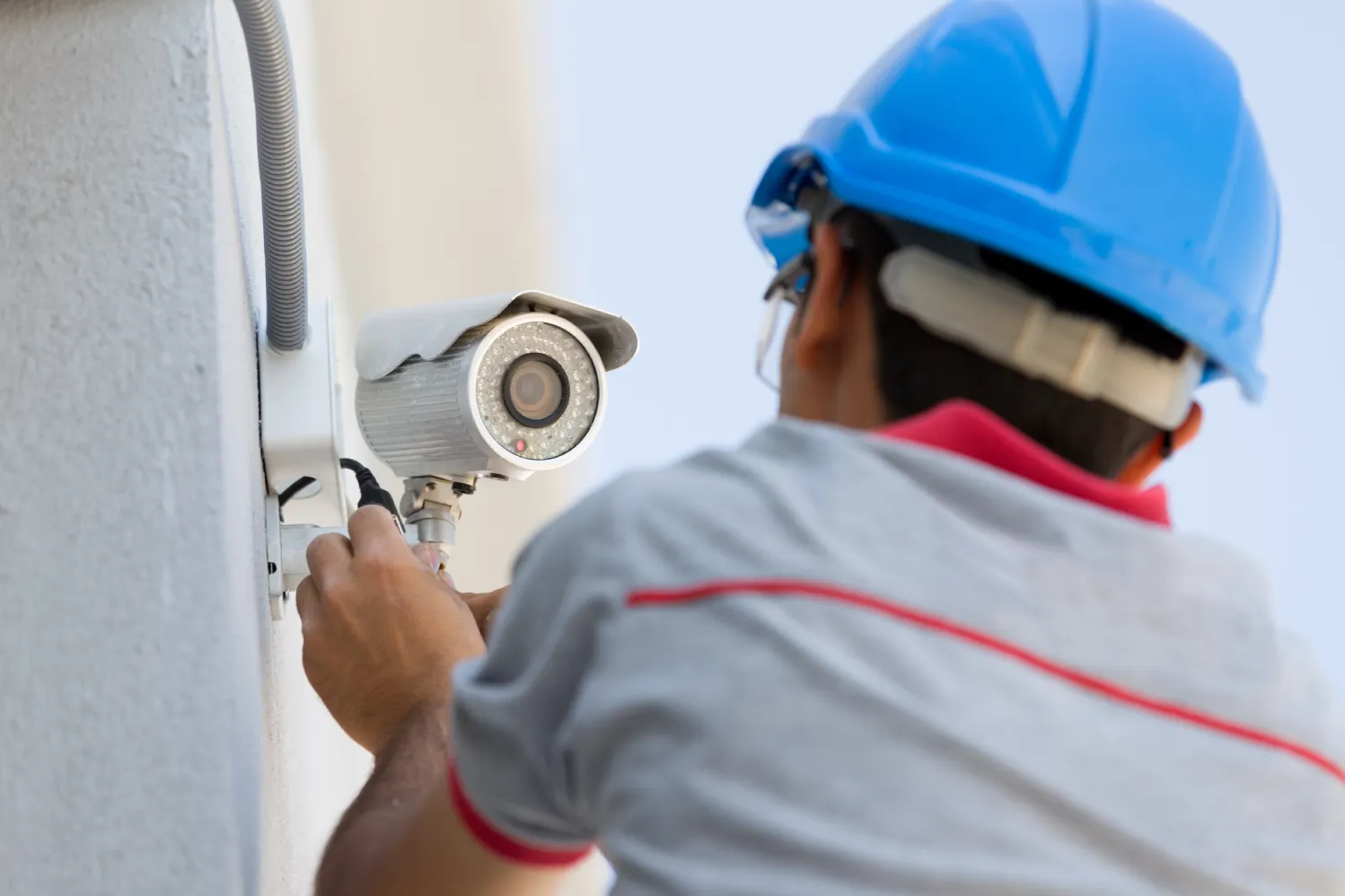 Technician Performing Security Camera Maintenance