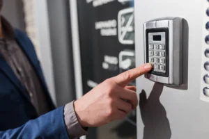 Person entering a code on a commercial access control systems keypad
